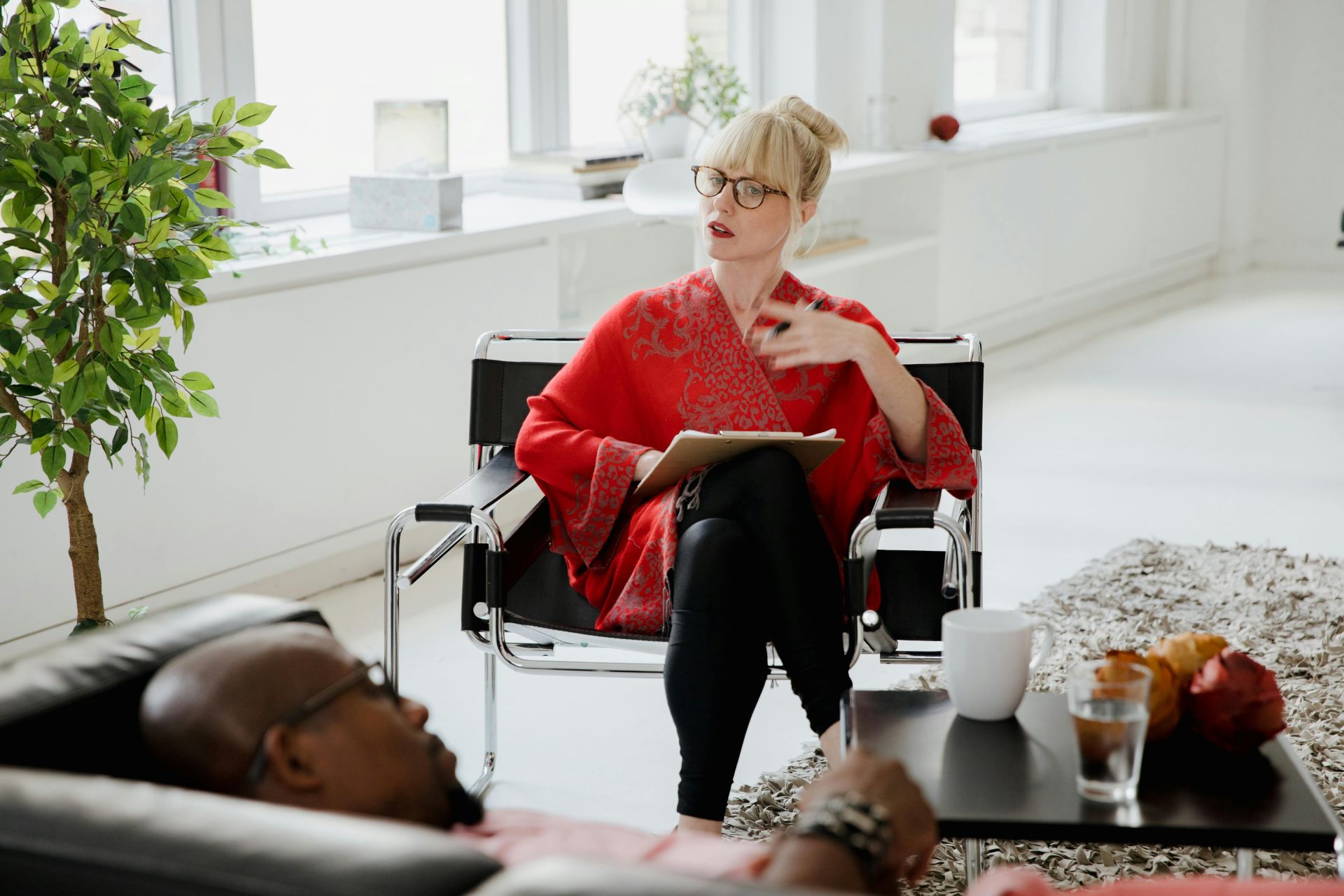 Man Lying on a Sofa and Talking to a Psychologist